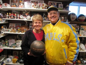 Arlene and Dick in their basement surrounded by memorabilia.